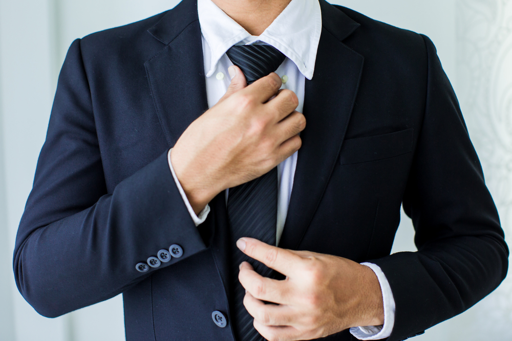 man-wear-black-tie-and-suit-for-interview